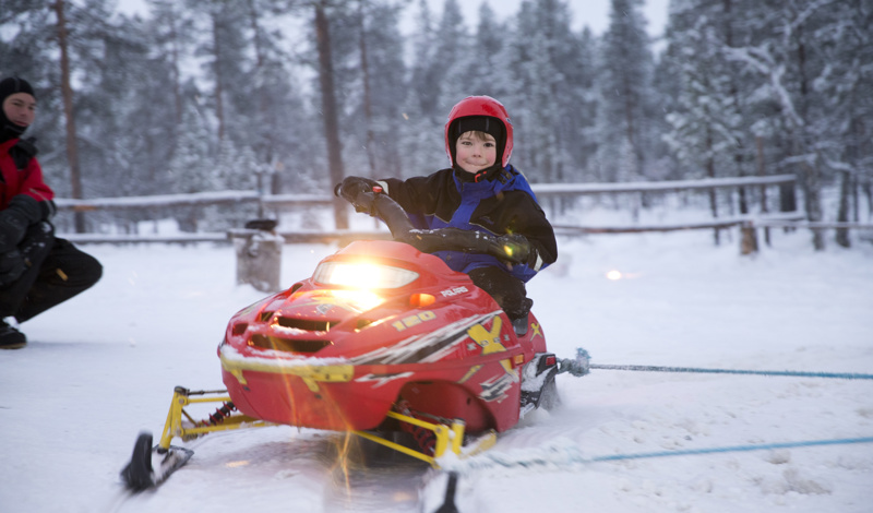 boy on mini skidoo