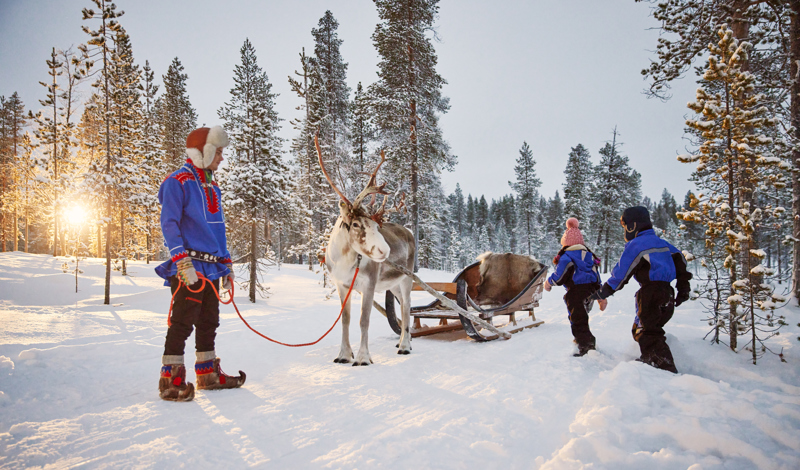 children running to reindeer ride